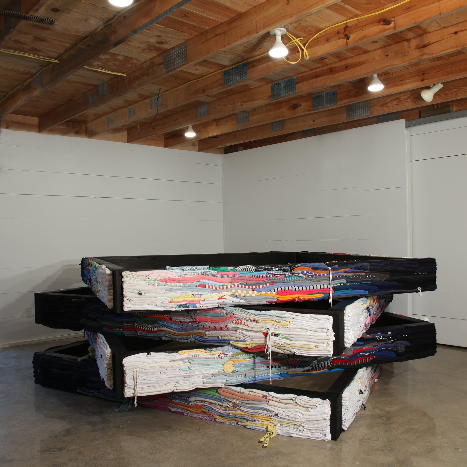 Melander works with used clothing, layered to create unique blends of color and structure.